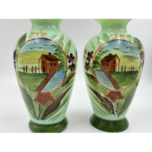 54 - A pair of late 19th/early 20th century hand painted glass vases - approx. 21cm high