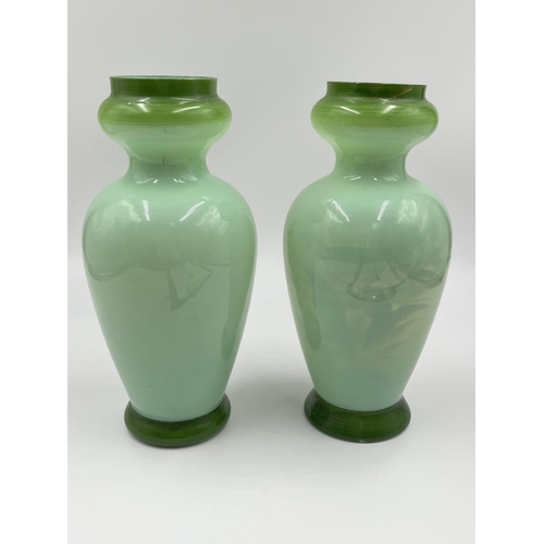 54 - A pair of late 19th/early 20th century hand painted glass vases - approx. 21cm high