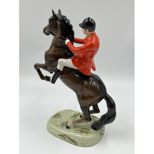 56 - A Beswick Huntsman On Rearing Horse figurine, model no. 868 - approx. 23.5cm high