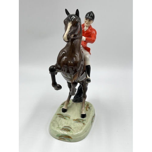 56 - A Beswick Huntsman On Rearing Horse figurine, model no. 868 - approx. 23.5cm high