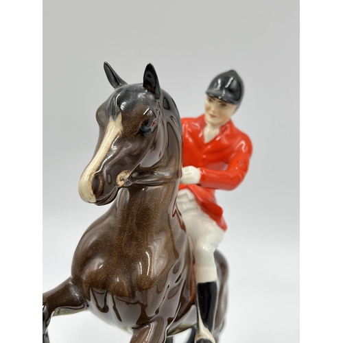 56 - A Beswick Huntsman On Rearing Horse figurine, model no. 868 - approx. 23.5cm high