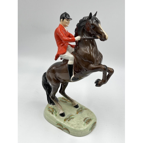 56 - A Beswick Huntsman On Rearing Horse figurine, model no. 868 - approx. 23.5cm high