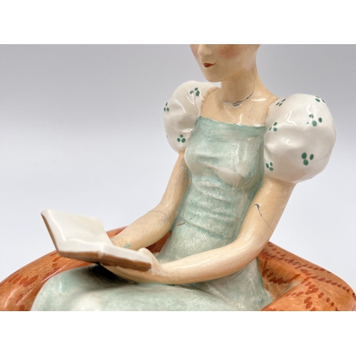 58 - A pair of Art Deco Goebel hand painted ceramic lady reading book bookends with impressed trademark o... 