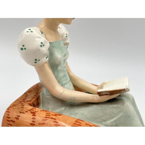 58 - A pair of Art Deco Goebel hand painted ceramic lady reading book bookends with impressed trademark o... 