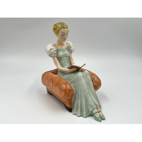 58 - A pair of Art Deco Goebel hand painted ceramic lady reading book bookends with impressed trademark o... 