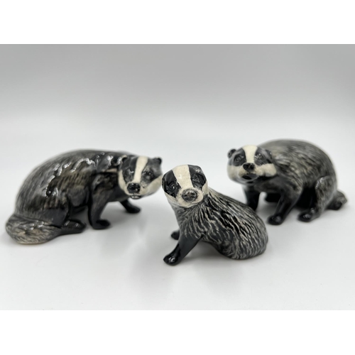 60 - A Beswick badger family comprising model no. 3392 cub, model no. 3393 male and model no.3394 female