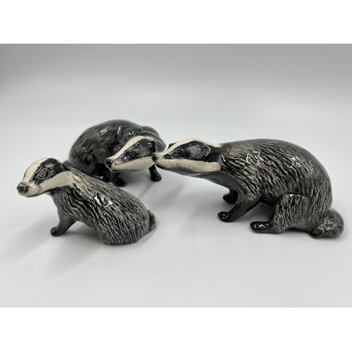 60 - A Beswick badger family comprising model no. 3392 cub, model no. 3393 male and model no.3394 female