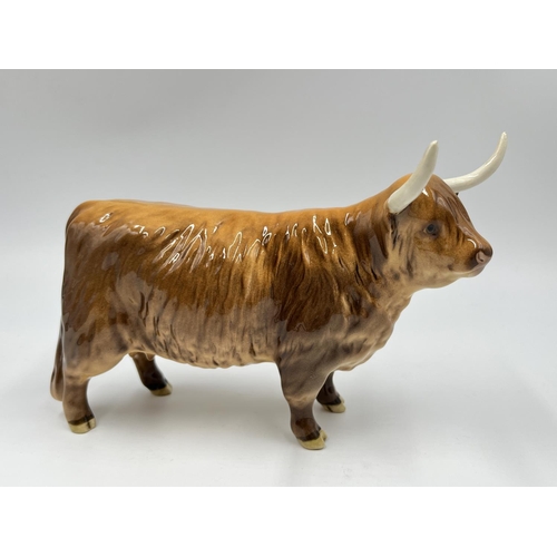 62 - A Beswick Highland Cow figurine - approx. 12.5cm high x 18cm long