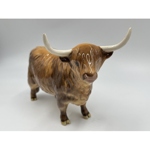 62 - A Beswick Highland Cow figurine - approx. 12.5cm high x 18cm long