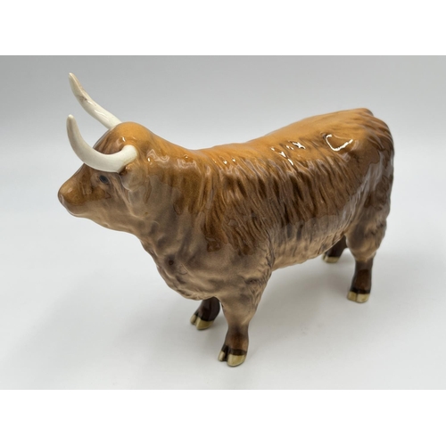 62 - A Beswick Highland Cow figurine - approx. 12.5cm high x 18cm long