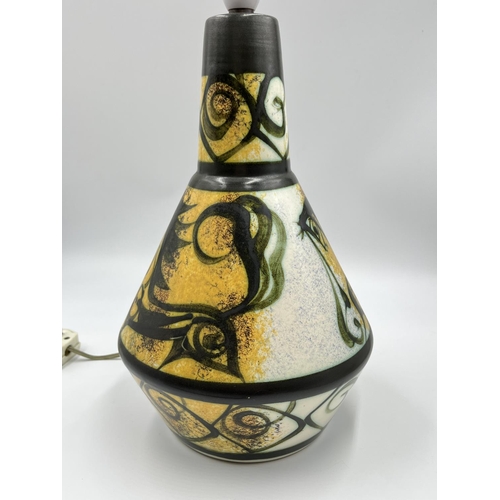 63 - A mid 20th century studio pottery table lamp - approx. 35cm high including holder