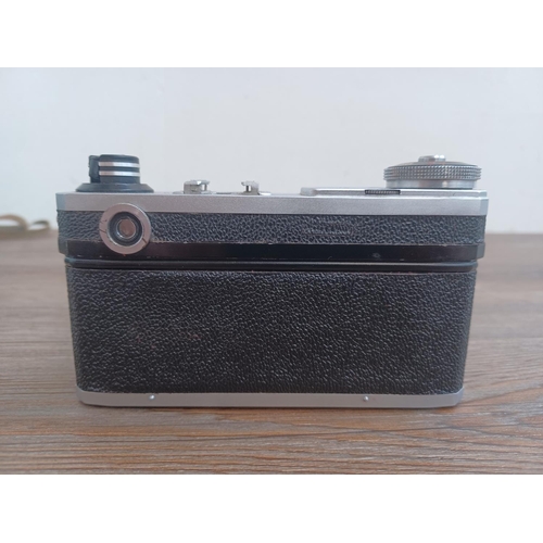 510 - A cased Arsenal Kiev (Киев) rangefinder camera fitted with (Helios-103?) 1.8/53 lens