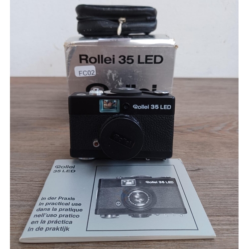 512 - A boxed and cased late 1970s Rollei 35 LED compact 35mm camera with instruction manual