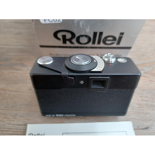 512 - A boxed and cased late 1970s Rollei 35 LED compact 35mm camera with instruction manual