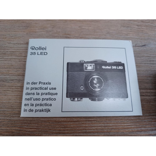 512 - A boxed and cased late 1970s Rollei 35 LED compact 35mm camera with instruction manual