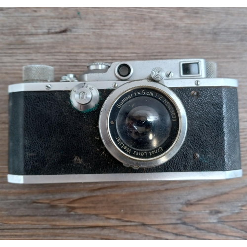 513 - A cased late 1940s Canon S-II 35mm combined rangefinder/viewfinder camera (serial no. 21279) fitted ... 