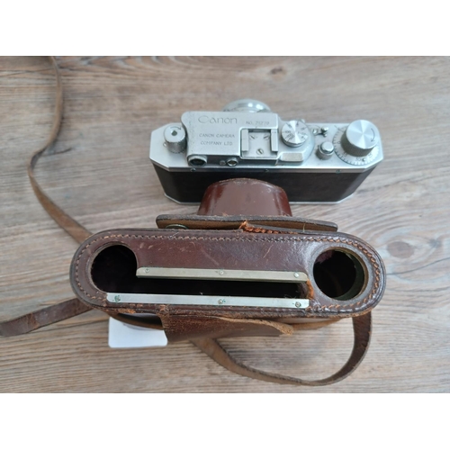 513 - A cased late 1940s Canon S-II 35mm combined rangefinder/viewfinder camera (serial no. 21279) fitted ... 