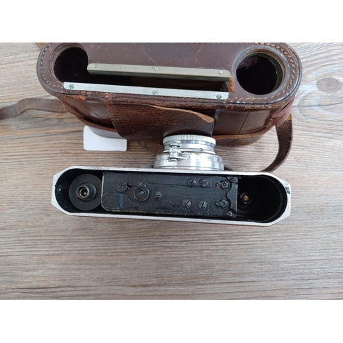 513 - A cased late 1940s Canon S-II 35mm combined rangefinder/viewfinder camera (serial no. 21279) fitted ... 