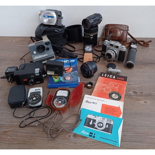 516 - A collection of cameras, camera equipment and accessories to include Rollei A 26 compact camera for ... 