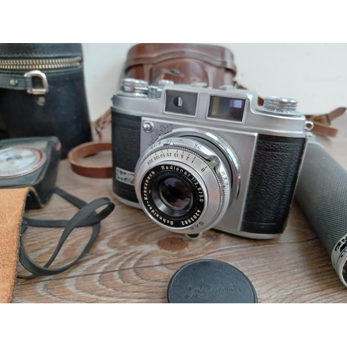 516 - A collection of cameras, camera equipment and accessories to include Rollei A 26 compact camera for ... 