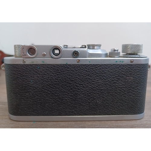 518 - Two items, one cased 1939 Ernst Leitz Leica IIIa 35mm rangefinder camera (serial no.314937) fitted w... 