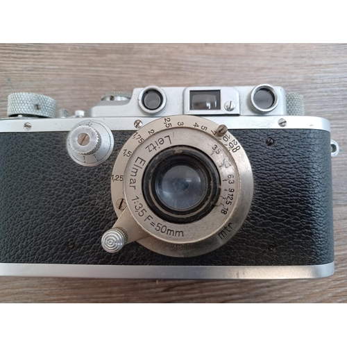 518 - Two items, one cased 1939 Ernst Leitz Leica IIIa 35mm rangefinder camera (serial no.314937) fitted w... 