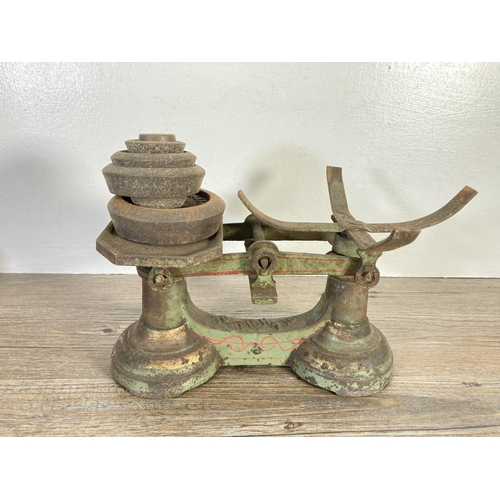 128A - Four vintage items, two beech spirit levels, set of cast iron weighing scales with weights and steel... 