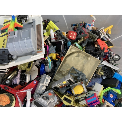 133 - A large collection of assorted toys to include 1991 Lewis Galoob Micromachines Super City camper RV ... 