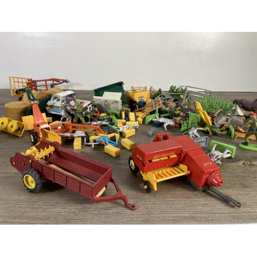 142 - A collection of Britains Limited model farm vehicles and figurines