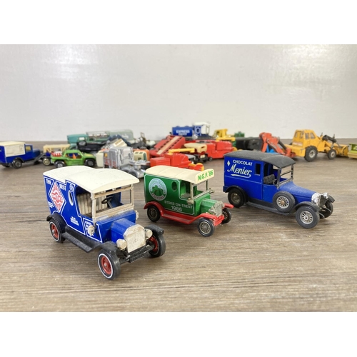 143 - A collection of assorted diecast model vehicles to include Matchbox 1912 Ford Model T, Dinky Alvis S... 