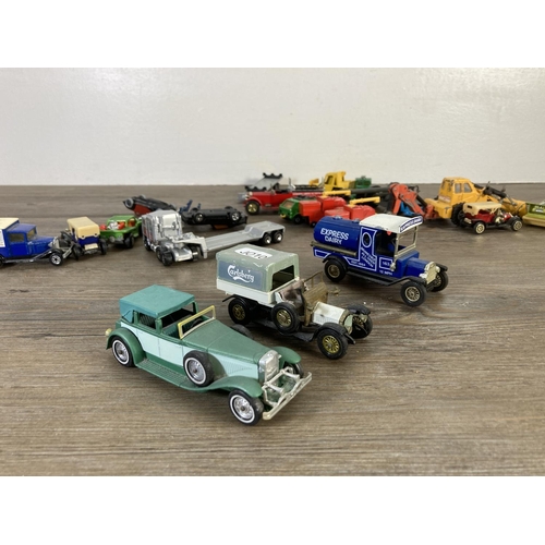 143 - A collection of assorted diecast model vehicles to include Matchbox 1912 Ford Model T, Dinky Alvis S... 