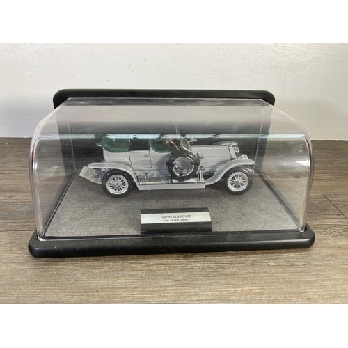 150 - Three Rolls Royce diecast model vehicles, one 1986 Franklin Mint 1907 The Silver Ghost with case and... 