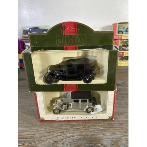 169 - A collection of assorted boxed diecast model vehicles to include Matchbox Models of Yesteryear 1912 ... 