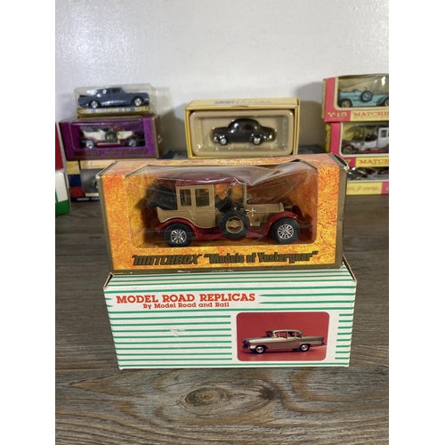 169 - A collection of assorted boxed diecast model vehicles to include Matchbox Models of Yesteryear 1912 ... 