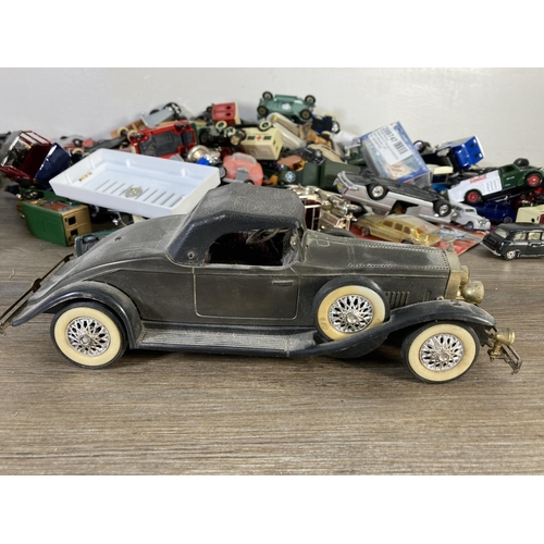 180 - A large collection of assorted diecast model vehicles to include Polistil Rolls Royce Corniche Droph... 