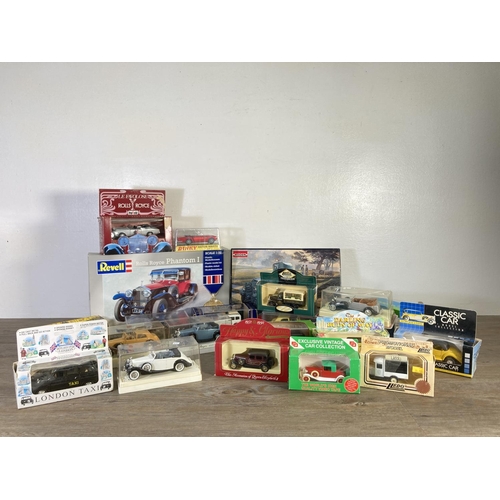 181 - A collection of assorted diecast model vehicles to include Rebell Rolls Royce Phantom I, Solido Roll... 