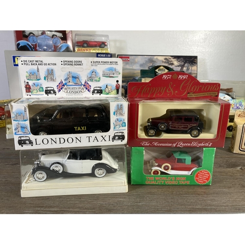 181 - A collection of assorted diecast model vehicles to include Rebell Rolls Royce Phantom I, Solido Roll... 