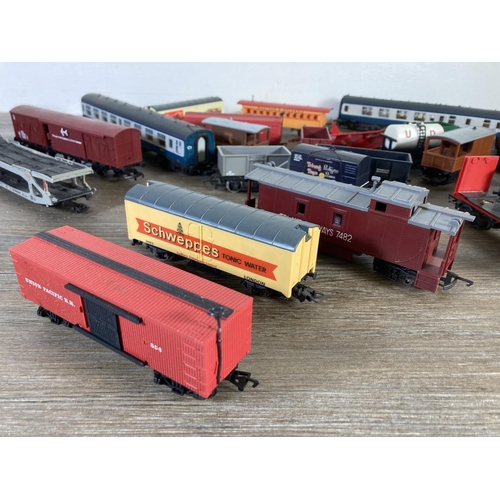 206 - A collection of various HO/OO gauge model railway accessories to include two Mainline passenger coac... 