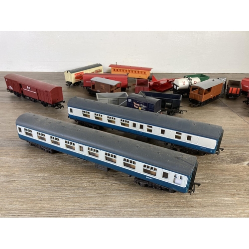 206 - A collection of various HO/OO gauge model railway accessories to include two Mainline passenger coac... 