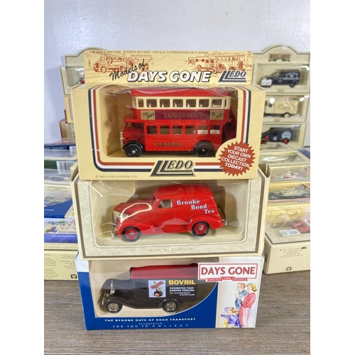 209 - A large collection of assorted boxed diecast model vehicles to include Lledo Days Gone, Vanguards Da... 