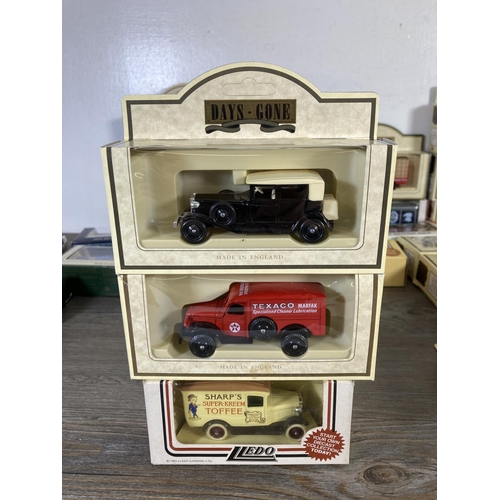 209 - A large collection of assorted boxed diecast model vehicles to include Lledo Days Gone, Vanguards Da... 