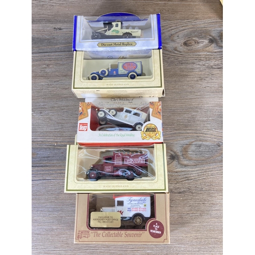 211 - A collection of assorted boxed diecast model vehicles to include Lledo Tetley's Tea's, Lledo promoti... 