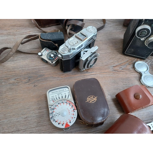 531 - A collection of camera equipment to include cased 1940s Franke & Heidecke Rolleicord IIc fitted with... 