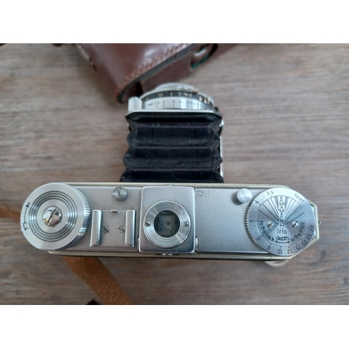 535 - Five folding cameras, one cased late 1930s Kodak Duo 620, one Zeiss Ikon Ikonta fitted with Zeiss Te... 