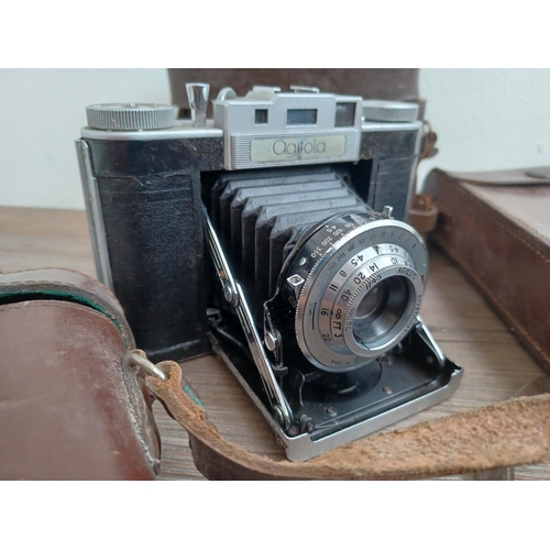 535 - Five folding cameras, one cased late 1930s Kodak Duo 620, one Zeiss Ikon Ikonta fitted with Zeiss Te... 