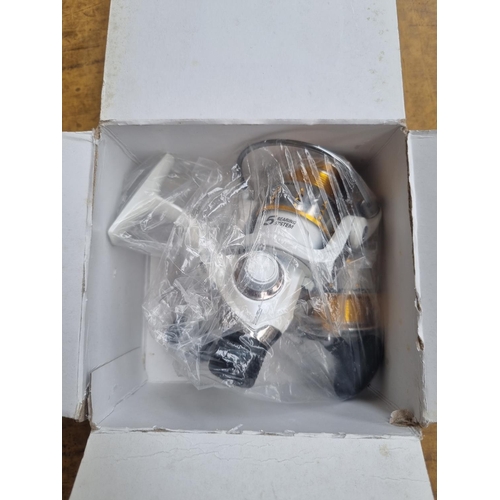 662 - A boxed Rovex Ceratec CT4 1000RD spinning reel with spare spool and handle