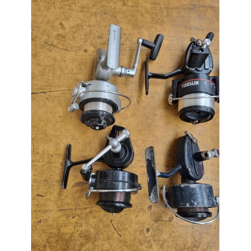 666 - Four vintage fishing reels comprising Mitchell 300S, Garcia Mitchell 324, Garcia Mitchell 410 and Da... 