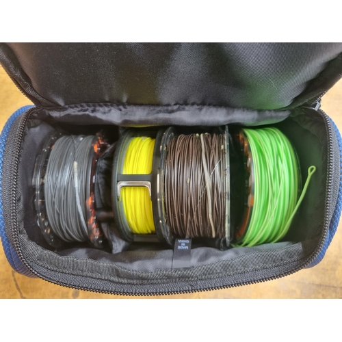 668 - A cased Leeda LC60 fly fishing reel with three spare spools