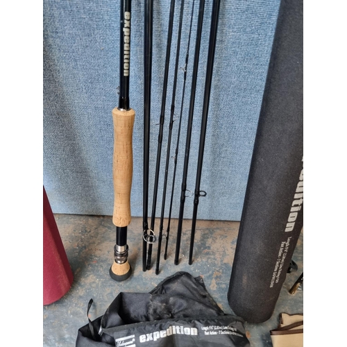 676 - Three cased fly fishing rods, one Shakespeare Expedition 9'6