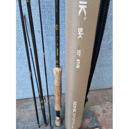 676 - Three cased fly fishing rods, one Shakespeare Expedition 9'6